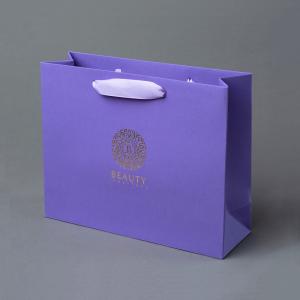 China Luxury Custom Printed Logo Embossed Purple Coated Paper Bag With Ribbon Handle on sale