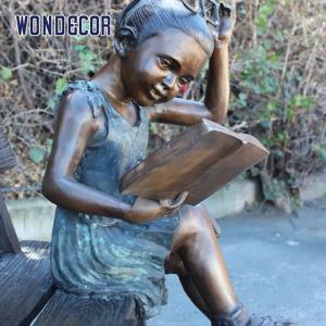 China Custom Life Size A bronze statue of a girl sitting on a bench reading a book on sale